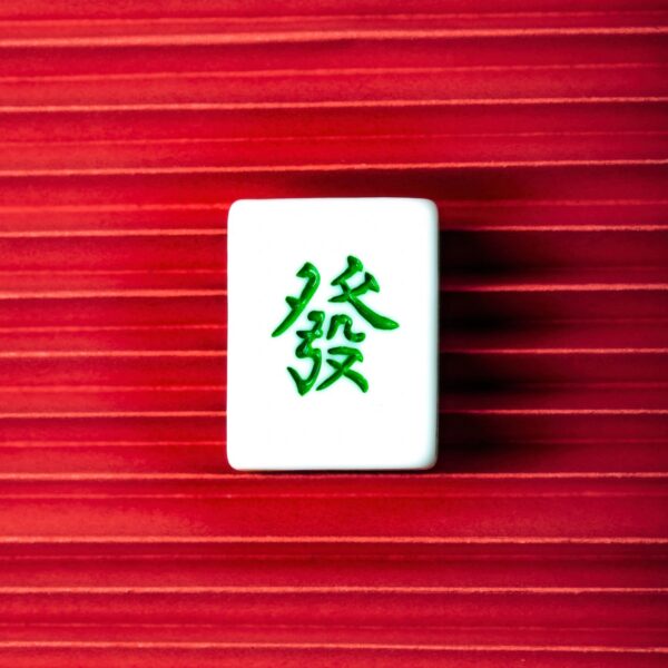 Chinese New Year Ornament. Mahjong with Fortune on red background, Happy New Chinese Year. copy space, flat lay.