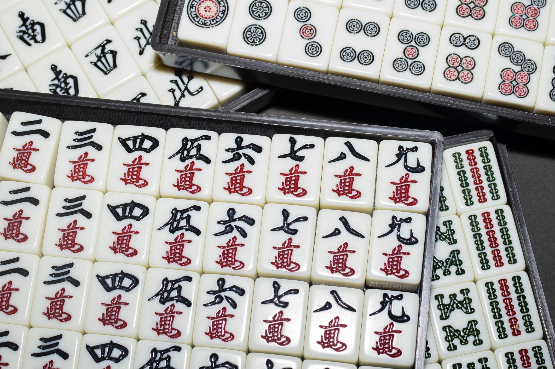 Close-up of Mahjong tiles arranged on a table